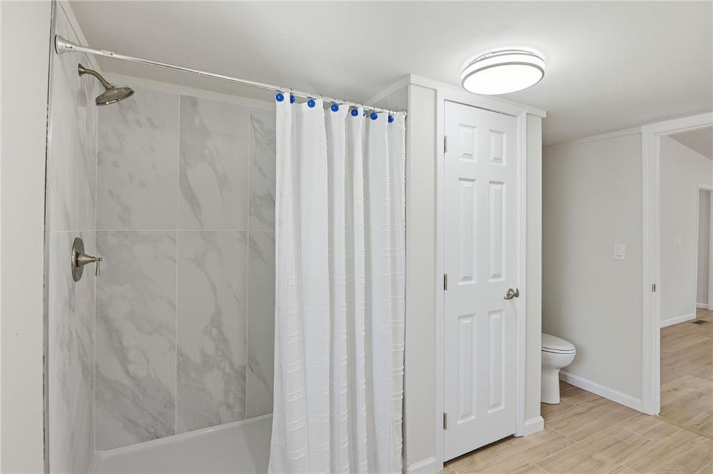 1780 Wynn Lake Road Alto, GA 30510 - Photo 17 of 30 a bathroom with a shower and a tub