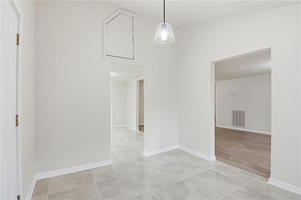 1780 Wynn Lake Road Alto, GA 30510 - Photo 5 of 30 an empty room with fan and entrance