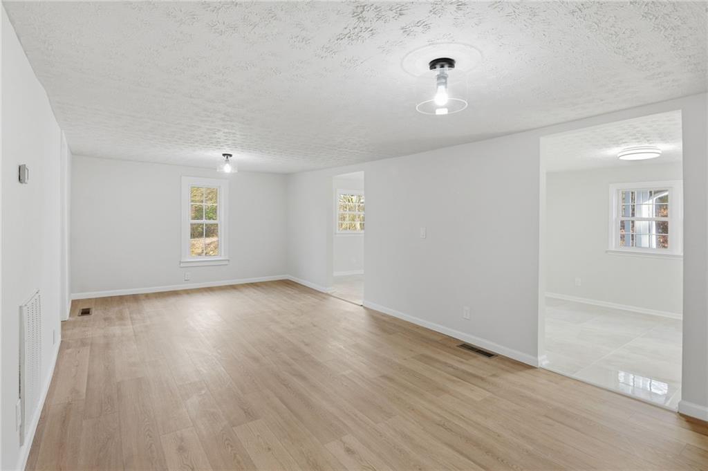 1780 Wynn Lake Road Alto, GA 30510 - Photo 8 of 30 wooden floor in an empty room with a window