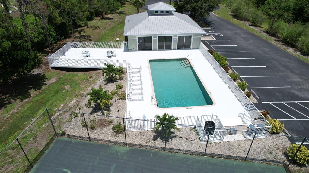 8050 Memory Lane, Unit 101 Rotonda West, FL 33947 - Photo 15 of 16 a aerial view of a house with a yard