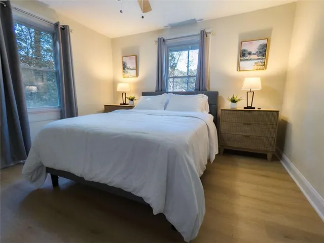 a bedroom with a bed and window