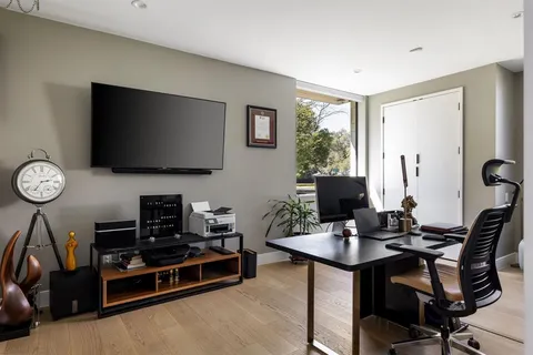a view of a workspace with furniture
