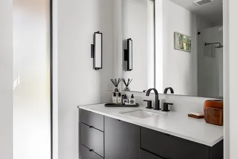 a bathroom with a sink and a mirror