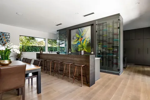 a view of a dining room with furniture window and outside view