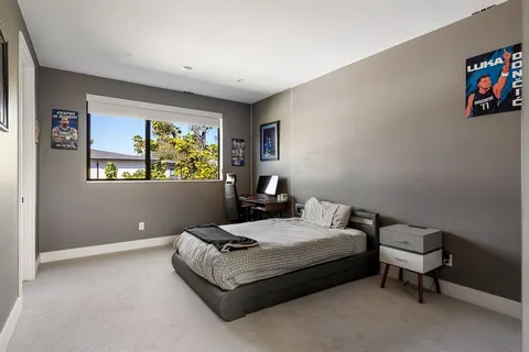 a bedroom with a bed and a table in it