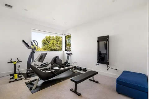 a bedroom with furniture and a window