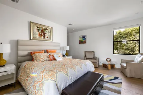 a bedroom with a bed and a couch