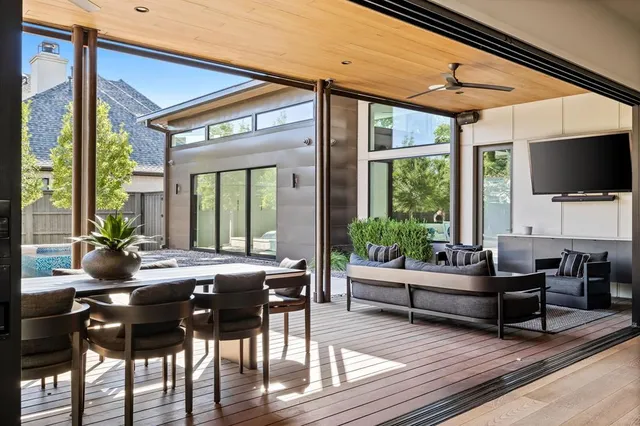 a potted plant sitting on a floor in front of a door