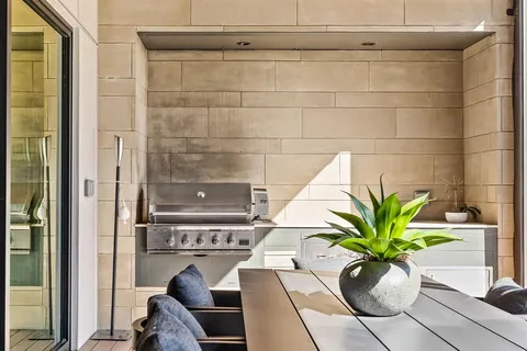 a potted plant sitting on a floor in front of a door