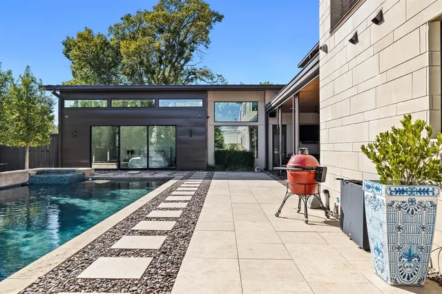 a view of a swimming pool with a patio