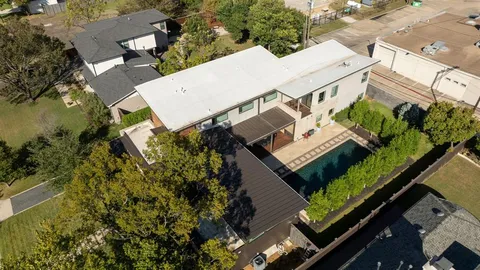 an aerial view of a house with a garden