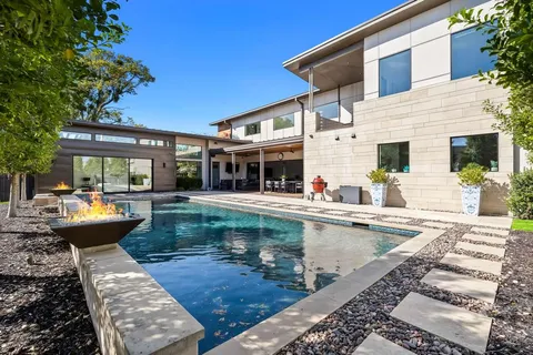 a view of a swimming pool with a patio