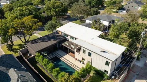 an aerial view of a house with a garden