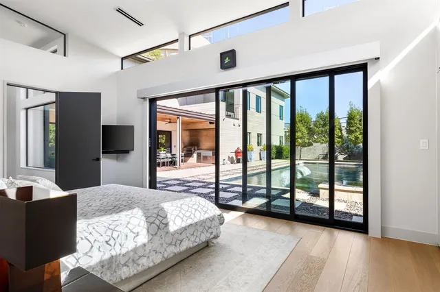 a bathroom with a double vanity sink a toilet and a tub
