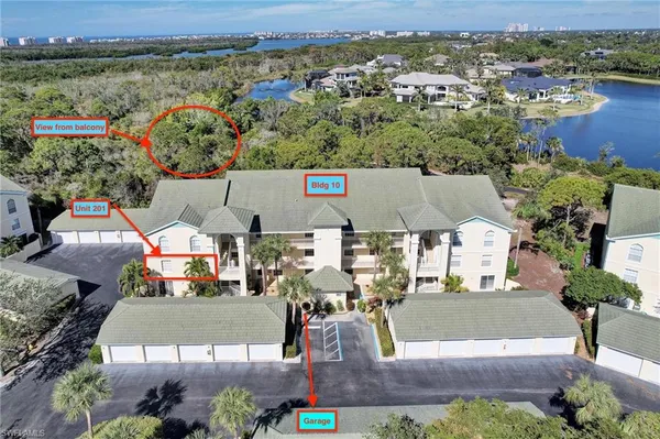 an aerial view of a house with a lake view