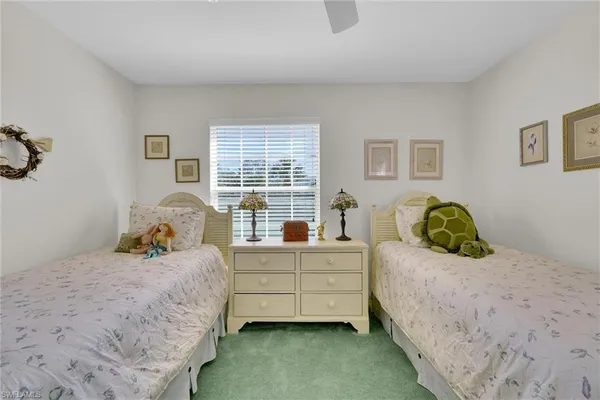 a bedroom with bed and a window