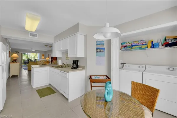a kitchen that has a sink and a stove
