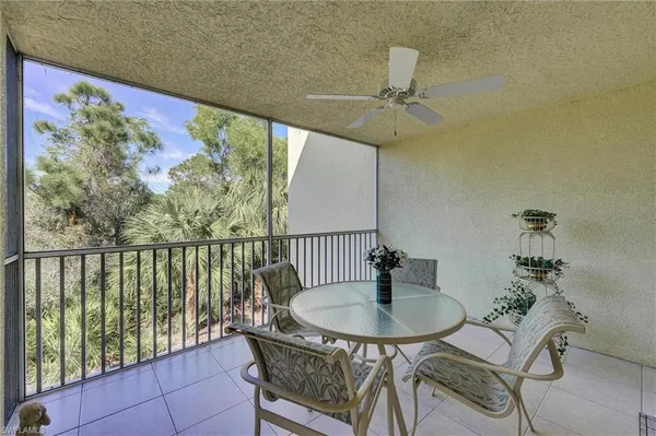 a table and chairs in a balcony