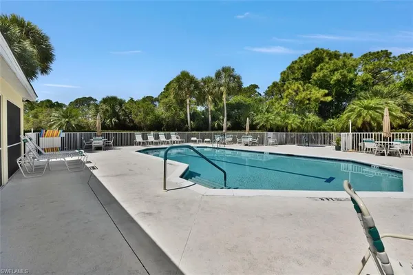 a view of swimming pool with a yard