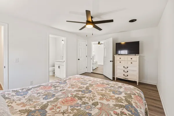 a bed room with a bed and a television