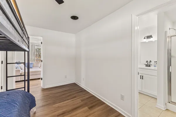 a view of hallway with wooden floor
