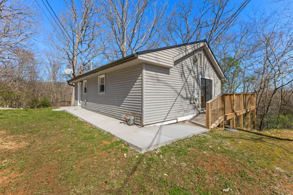 a view of backyard with small cabin