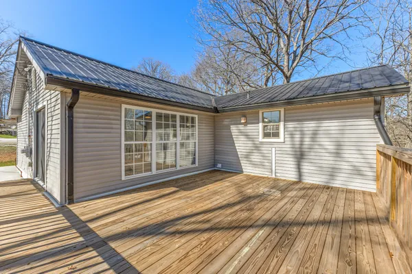 a front view of a house with a large window
