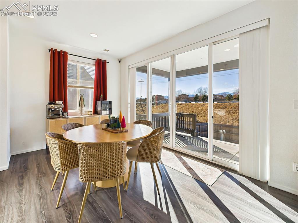 6272 Anders Ridge Lane Colorado Springs, CO 80927 - Photo 14 of 50 Light-filled dining area with direct access to the backyard via an 11’6” wide by 7’6” tall patio slider that maximizes natural light and backyard visibility.