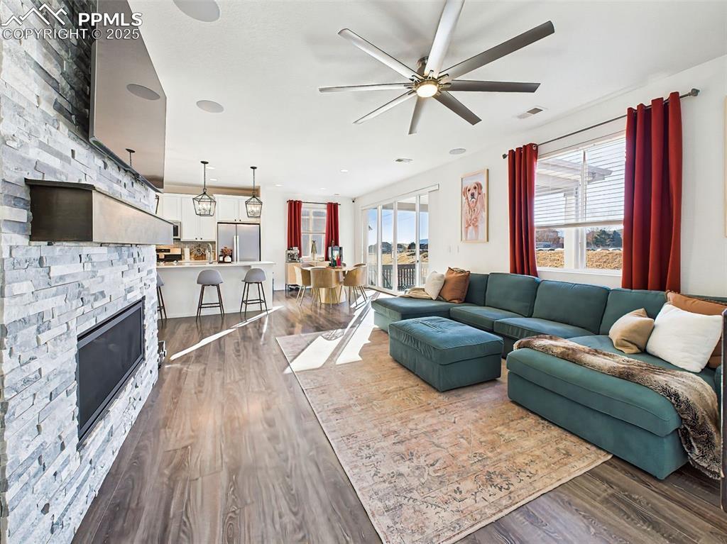 6272 Anders Ridge Lane Colorado Springs, CO 80927 - Photo 16 of 50 Ample natural light fills the space thanks to an oversized sliding glass door, highlighting the home’s thoughtful layout and finishes.