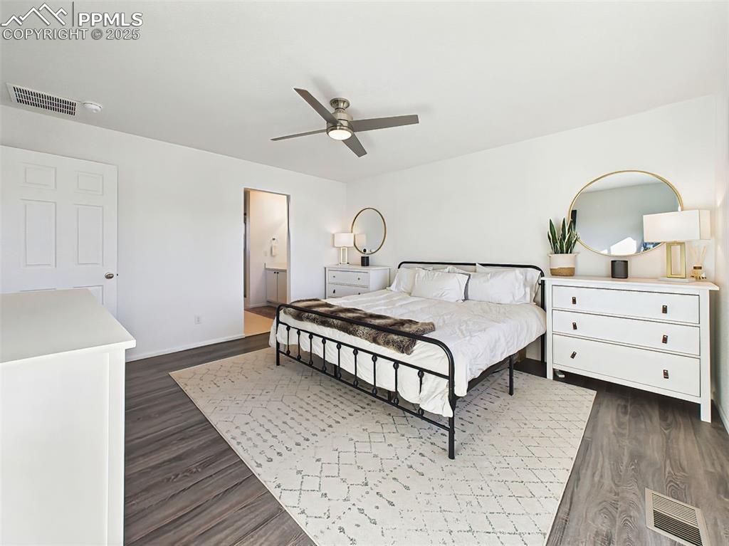 6272 Anders Ridge Lane Colorado Springs, CO 80927 - Photo 29 of 50 Clean and calming design with space for a full bedroom set and access to the en suite bath and walk-in closet.