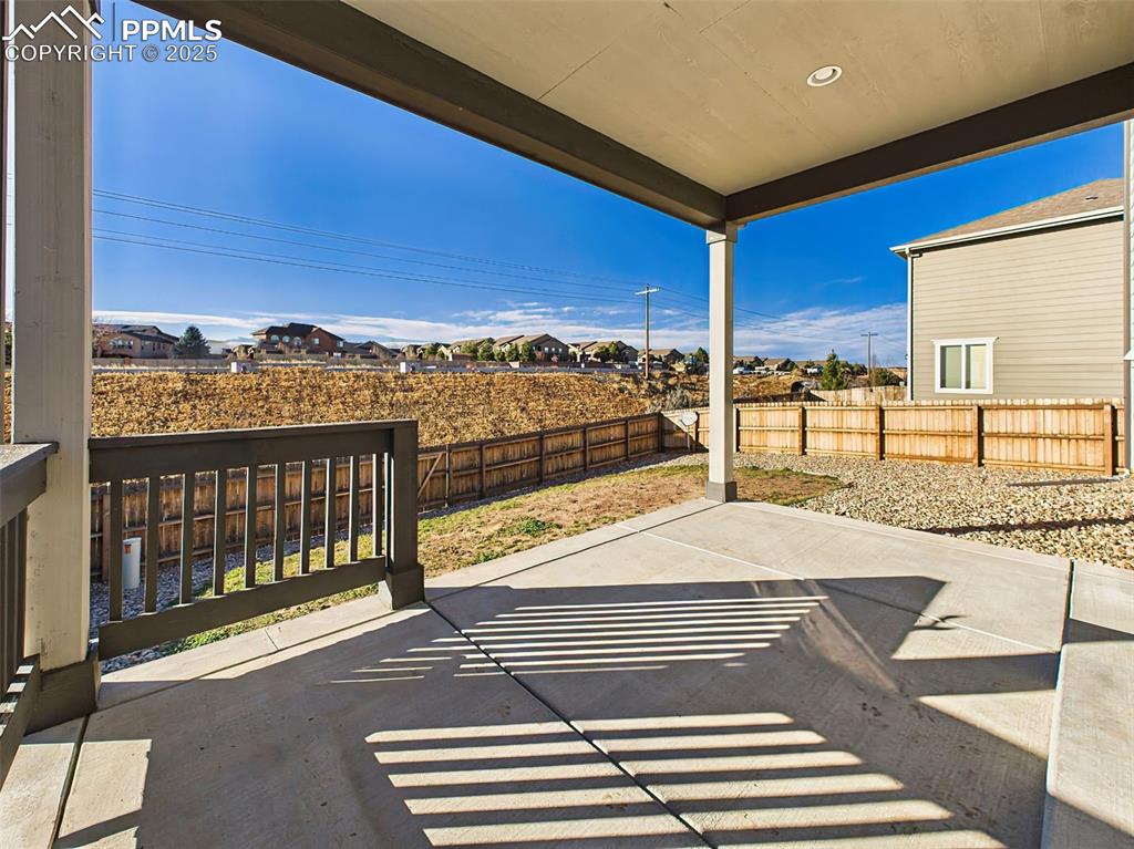 6272 Anders Ridge Lane Colorado Springs, CO 80927 - Photo 46 of 50 Enjoy shaded outdoor living under the upgraded covered patio—ideal for grilling, dining, or simply relaxing in the afternoon sun.