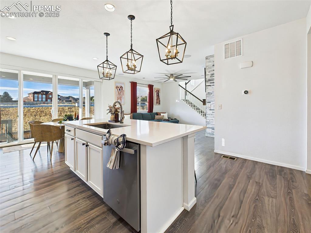 6272 Anders Ridge Lane Colorado Springs, CO 80927 - Photo 9 of 50 The open-concept layout flows seamlessly into the great room, enhanced by wide-plank flooring and an oversized 11’6” patio slider offering natural light and Pikes Peak views.