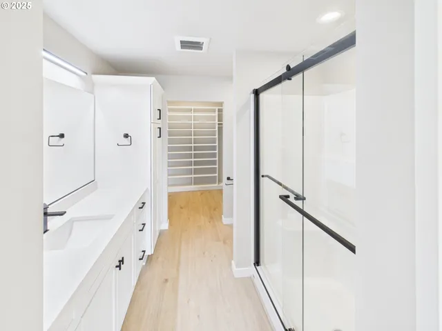 a bathroom with a shower and a tub