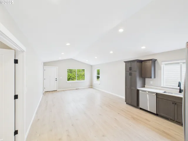 a view of a kitchen with a sink cabinets and a window