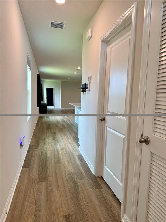 3222 Bitterroot Lane Bradenton, FL 34211 - Photo 17 of 34 a view of a walk in closet with wooden floor