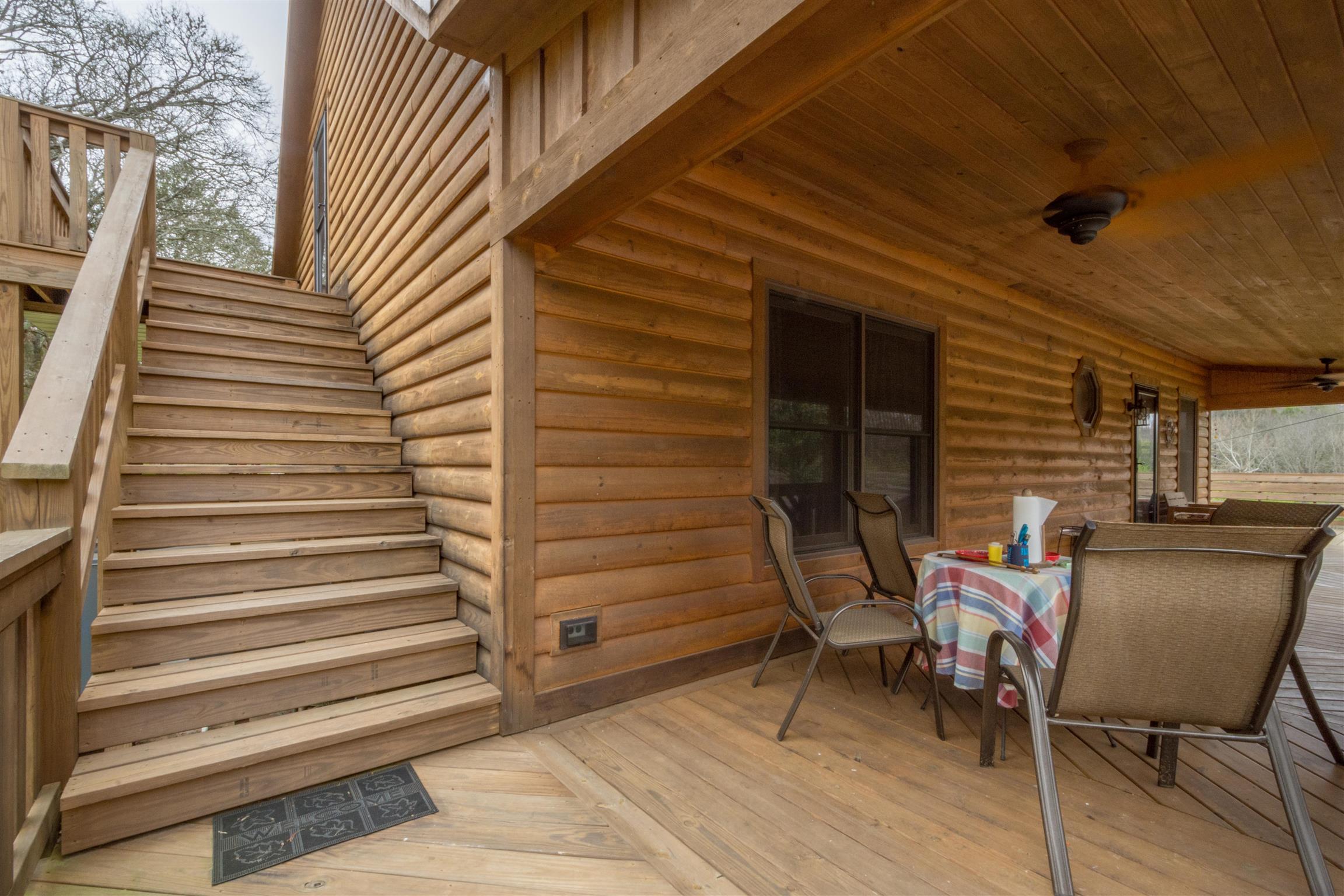 2211 Poplar Hill Road Prospect, TN 38477 - Photo 5 of 30 a view of a patio with a table and chairs and a barbeque