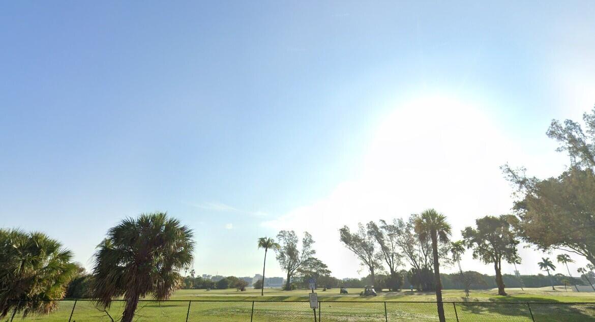 131 North Golfview Road, Unit 4 Lake Worth Beach, FL 33460 - Photo 12 of 13 a view of a field with trees