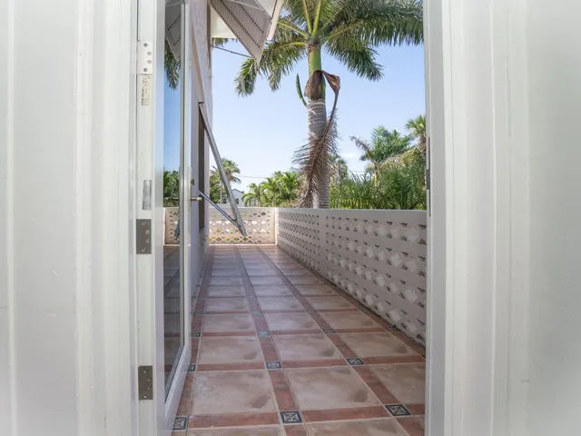 a view of a pathway both side of a house