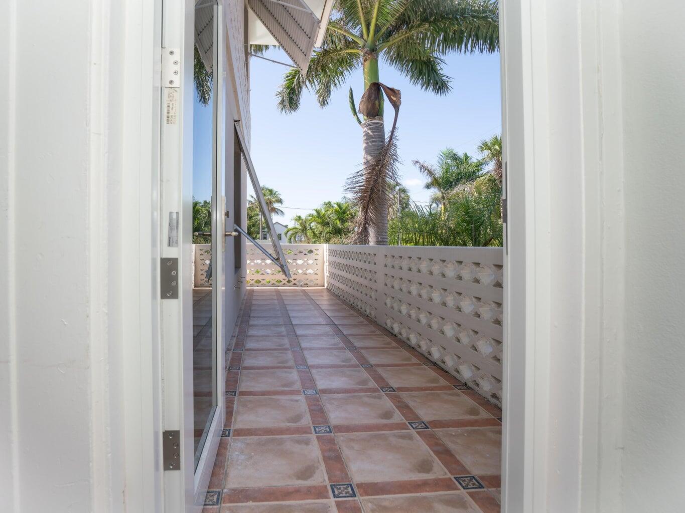 131 North Golfview Road, Unit 4 Lake Worth Beach, FL 33460 - Photo 3 of 13 a view of a pathway both side of a house
