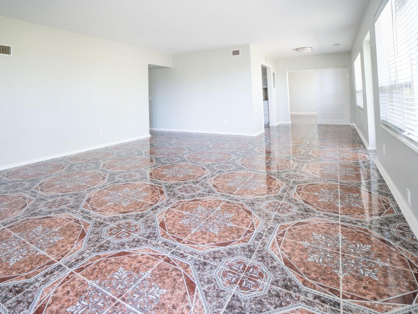 131 North Golfview Road, Unit 4 Lake Worth Beach, FL 33460 - Photo 8 of 13 an empty room with a natural light