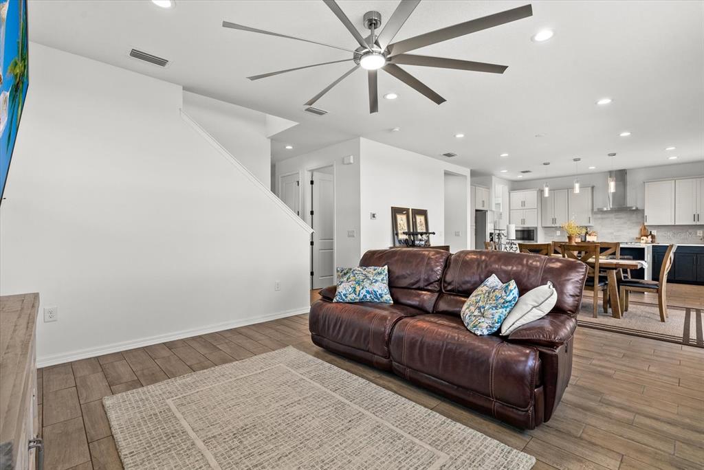 8330 Abalone Loop Palmetto, FL 34221 - Photo 13 of 45 a living room with furniture and a wooden floor