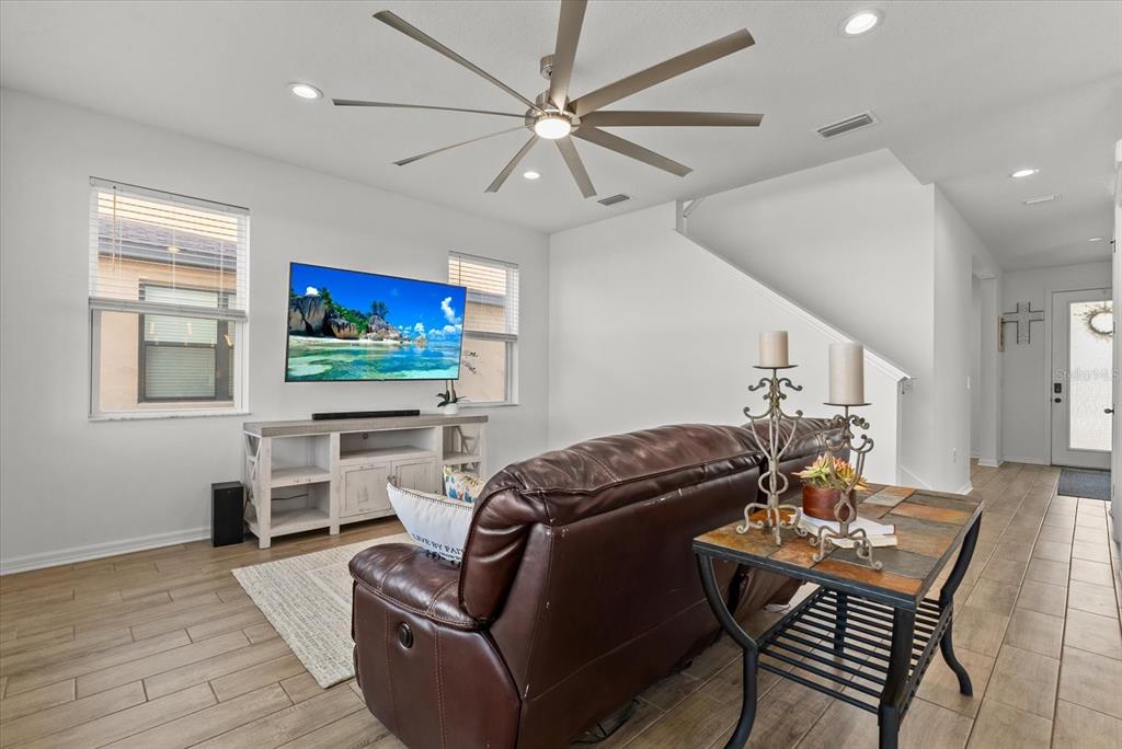 8330 Abalone Loop Palmetto, FL 34221 - Photo 15 of 45 a living room with furniture and a flat screen tv