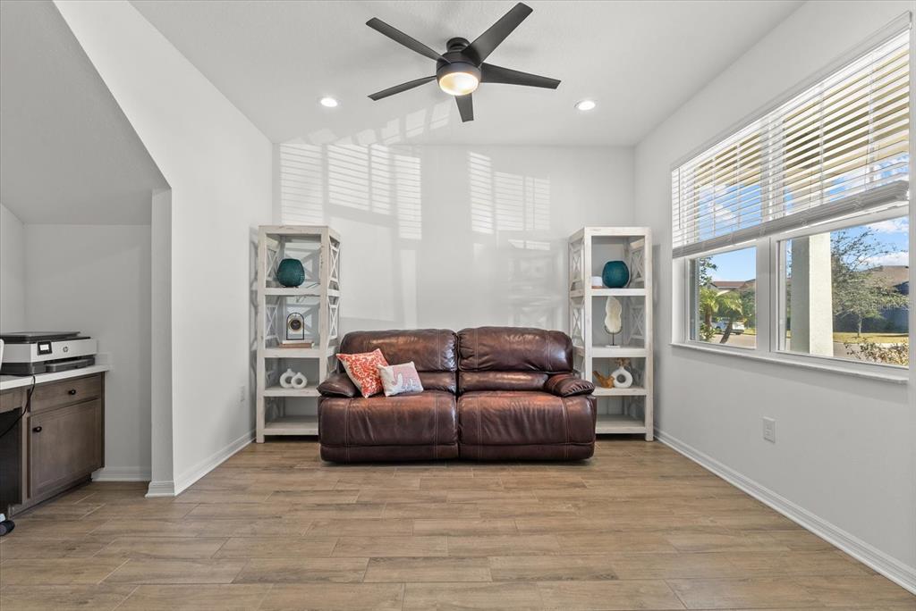 8330 Abalone Loop Palmetto, FL 34221 - Photo 16 of 45 a living room with furniture and a window