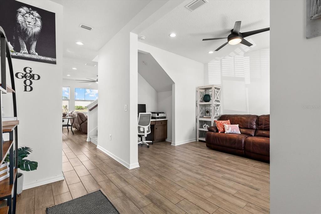 8330 Abalone Loop Palmetto, FL 34221 - Photo 18 of 45 a living room with furniture and a wooden floor