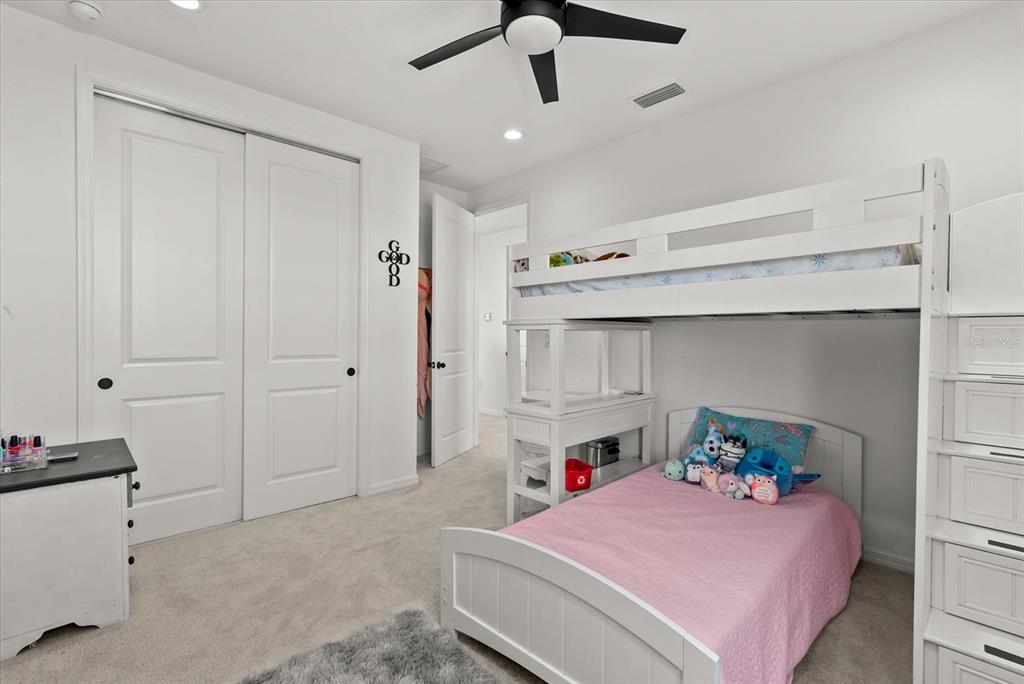 8330 Abalone Loop Palmetto, FL 34221 - Photo 29 of 45 a bedroom with a bed and a tv