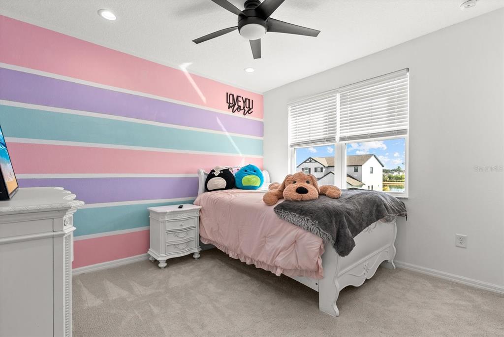 8330 Abalone Loop Palmetto, FL 34221 - Photo 30 of 45 a bed room with a bed and a window