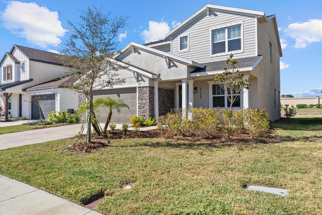 8330 Abalone Loop Palmetto, FL 34221 - Photo 3 of 45 a view of a house with backyard porch and sitting area
