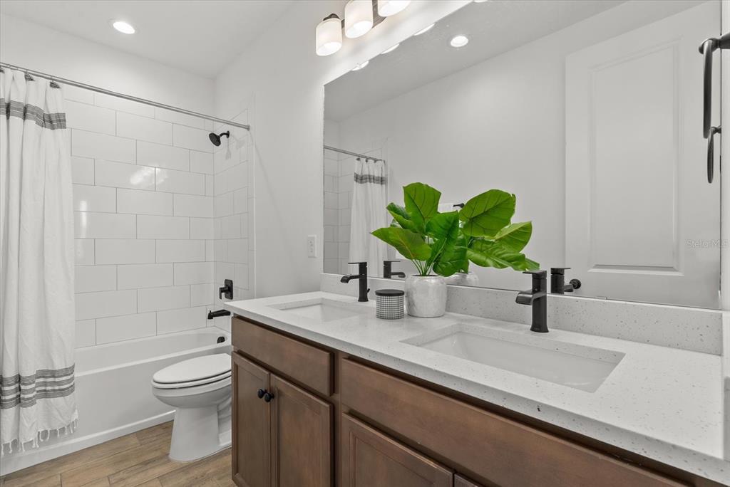 8330 Abalone Loop Palmetto, FL 34221 - Photo 31 of 45 a bathroom with a sink a toilet and shower