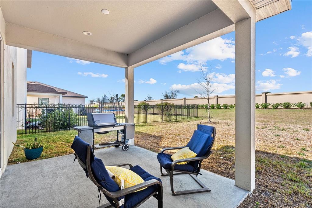 8330 Abalone Loop Palmetto, FL 34221 - Photo 34 of 45 a building outdoor space with patio furniture and garden