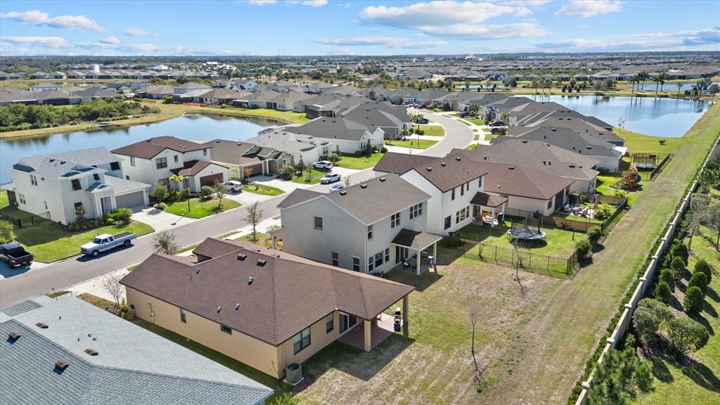 8330 Abalone Loop Palmetto, FL 34221 - Photo 41 of 45 an aerial view of residential houses with outdoor space